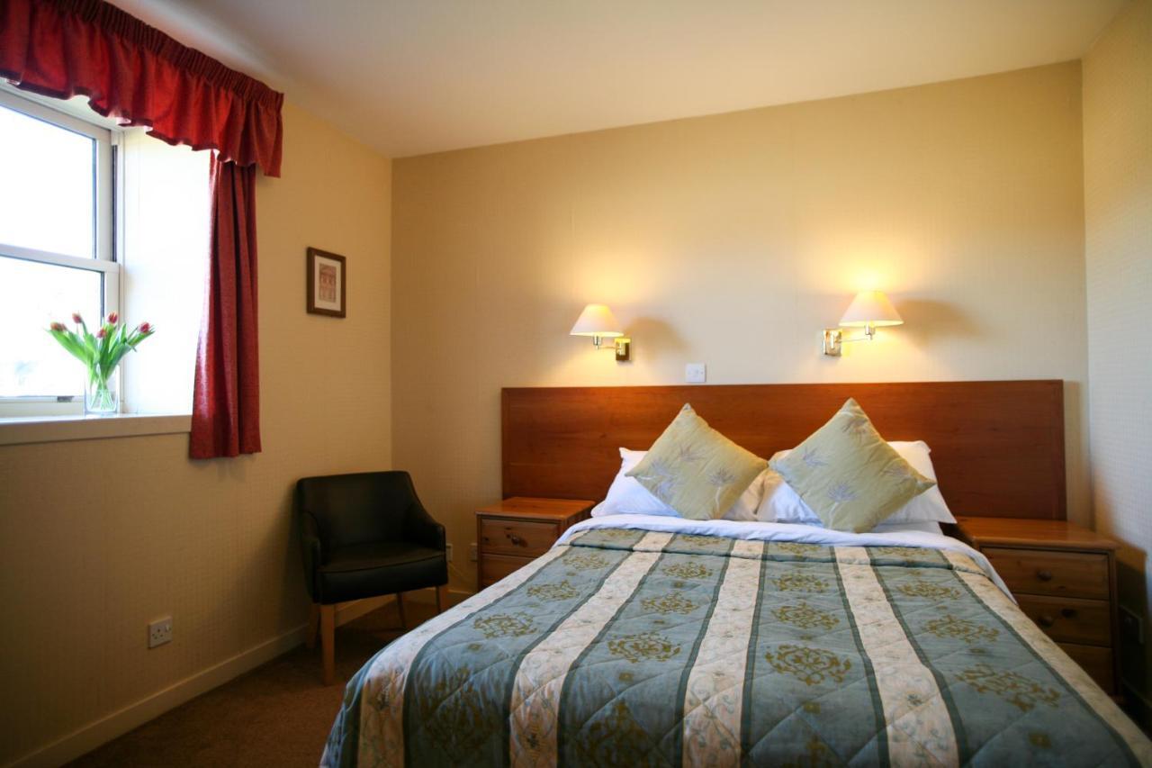 The Tomich Hotel Bagian luar foto
